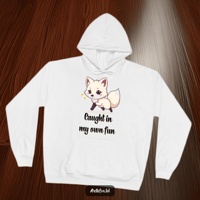 Funny hoodie design of a happy Arctic fox with a playful glint in its eyes, energetically chasing its tail in a fun, circular motion.