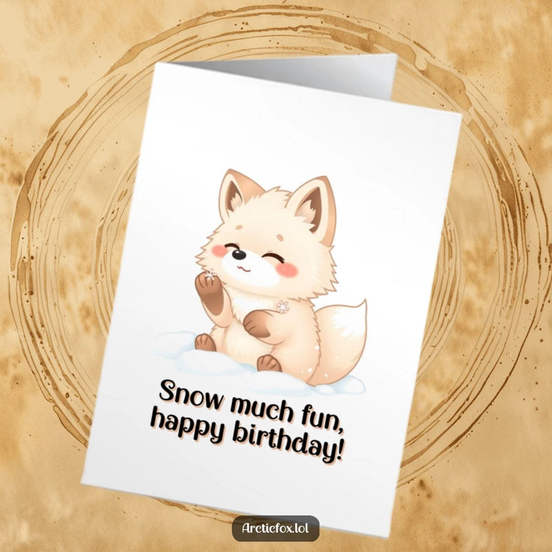 Funny free printable arctic fox birthday card, a fluffy fox catching a snowflake with its paws in the snow.