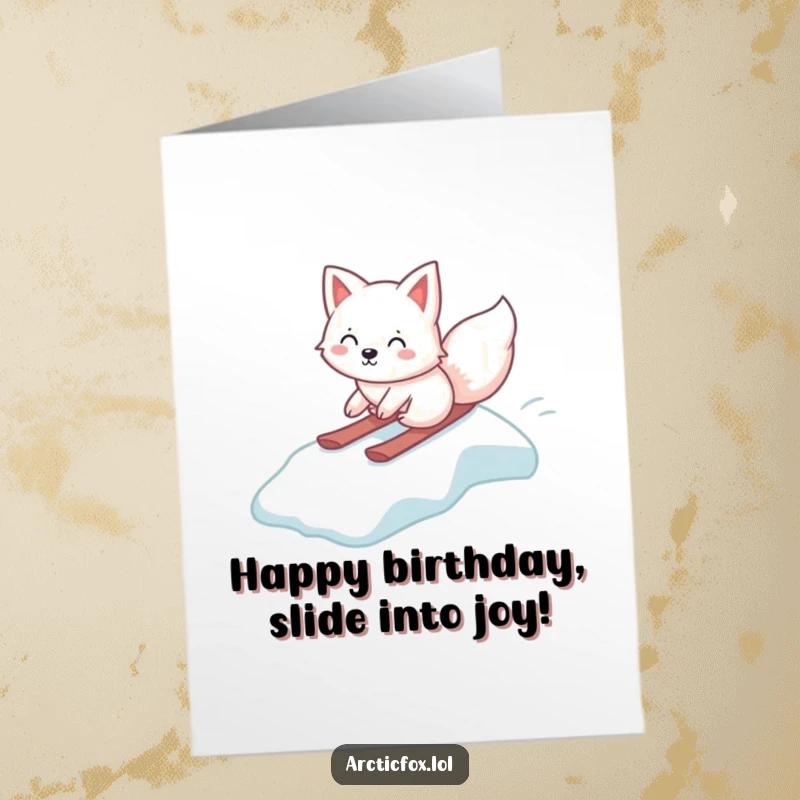 Funny Free Printable Birthday Card: A kawaii arctic fox slides gleefully down a small icy slope with pure joy and excitement.