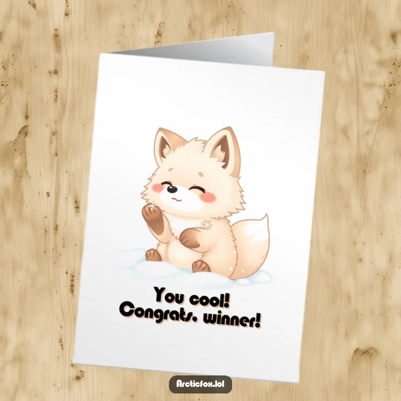 Funny free printable arctic fox congratulations card, a fluffy fox gleefully catching a snowflake in the snow.