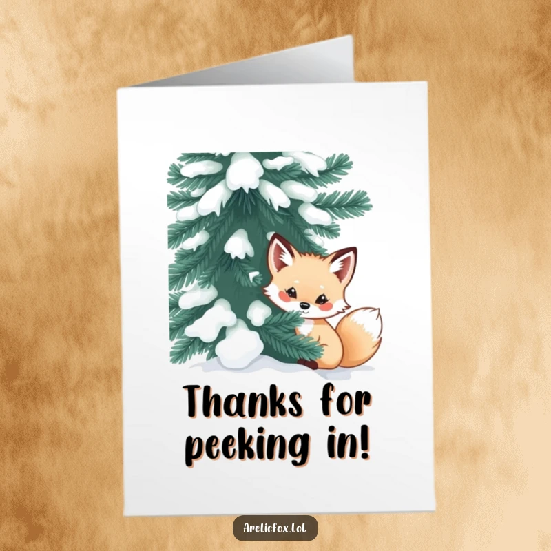Funny Free Printable Thank You Card: Curious arctic fox peeking out from behind a large, snow-dusted evergreen.