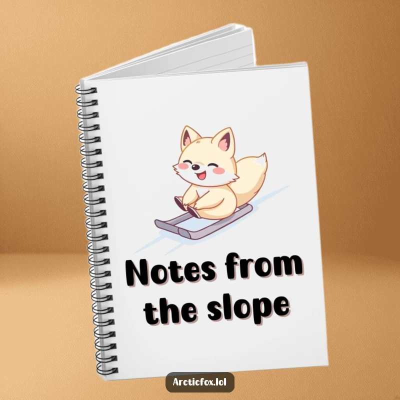 Cute Arctic fox sliding gleefully down a snowy slope, on the cover of a notebook, perfect for notes.