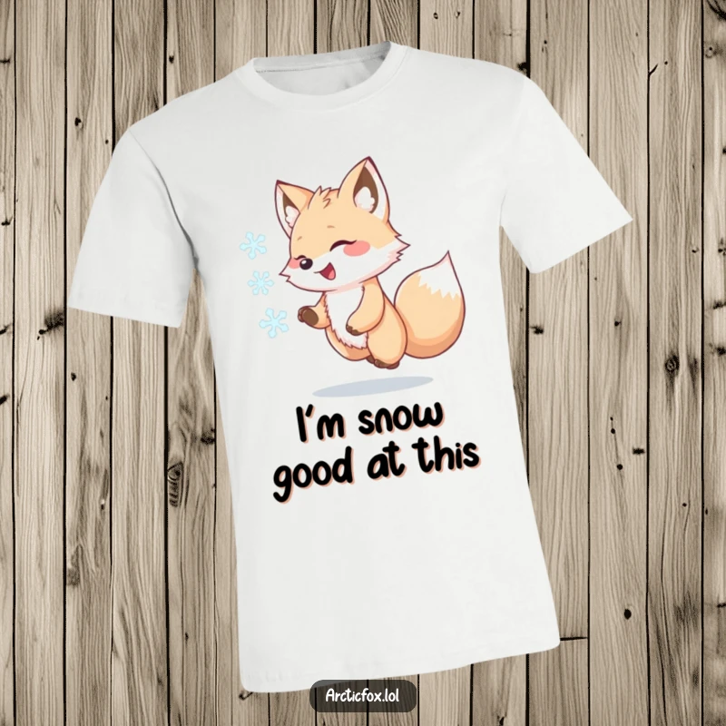 Funny Kawaii Arctic Fox T-Shirt, joyfully chasing a swirling snowflake, cute and whimsical animal graphic, awesome gift for arctic lovers