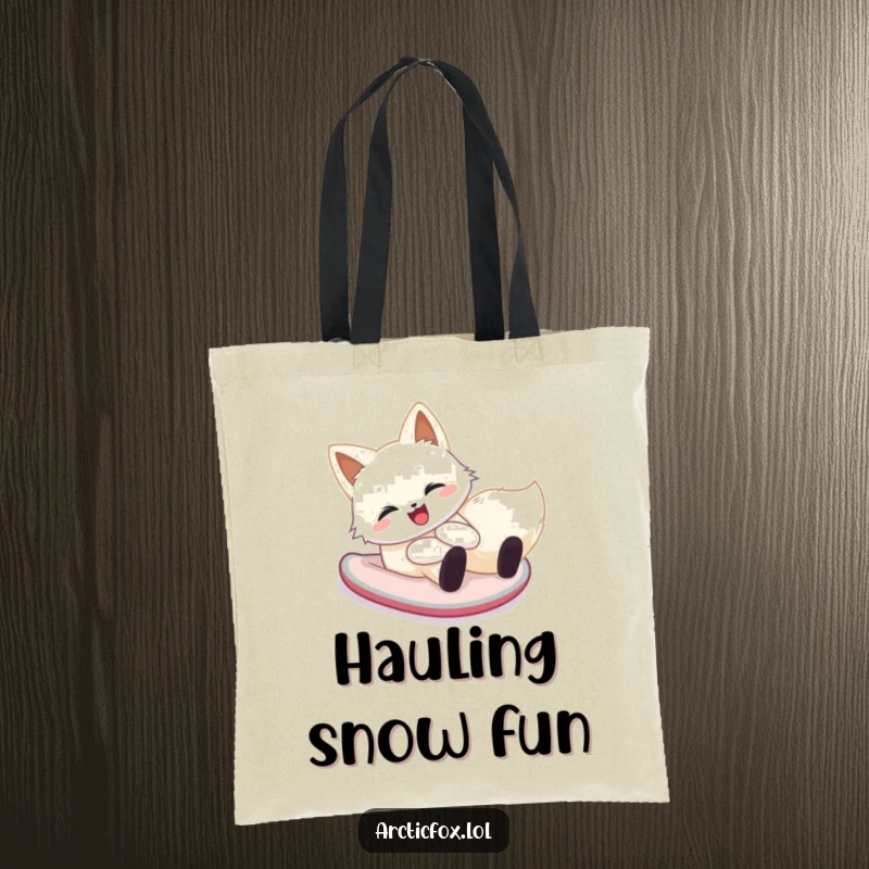 Funny arctic fox tote bag featuring a happy creature sliding down a snowy hill on its belly, perfect for carrying winter joy.